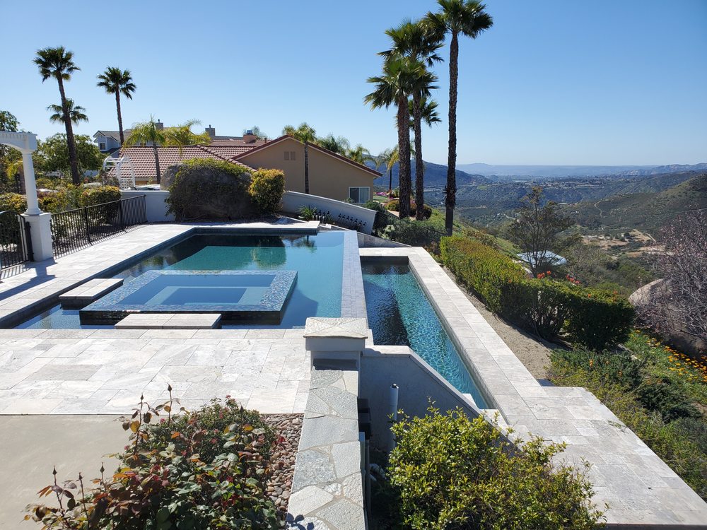 Luxury infinity pool with spa and panoramic San Diego mountain views